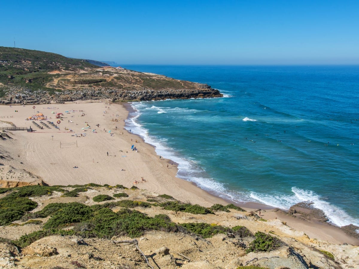Surfers at a beach in Ericeira