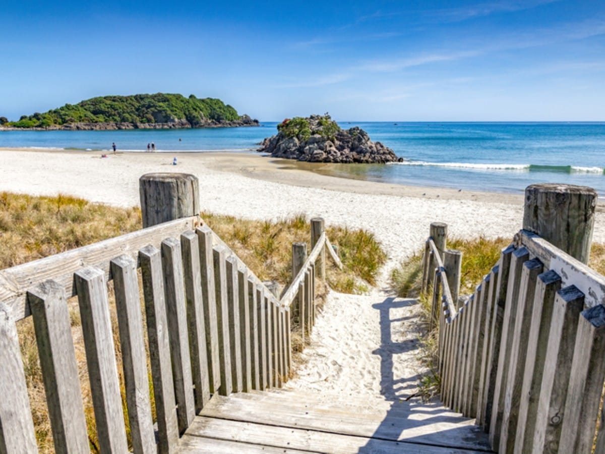 A boardwalk leads down to Mount Maunganui's main beach