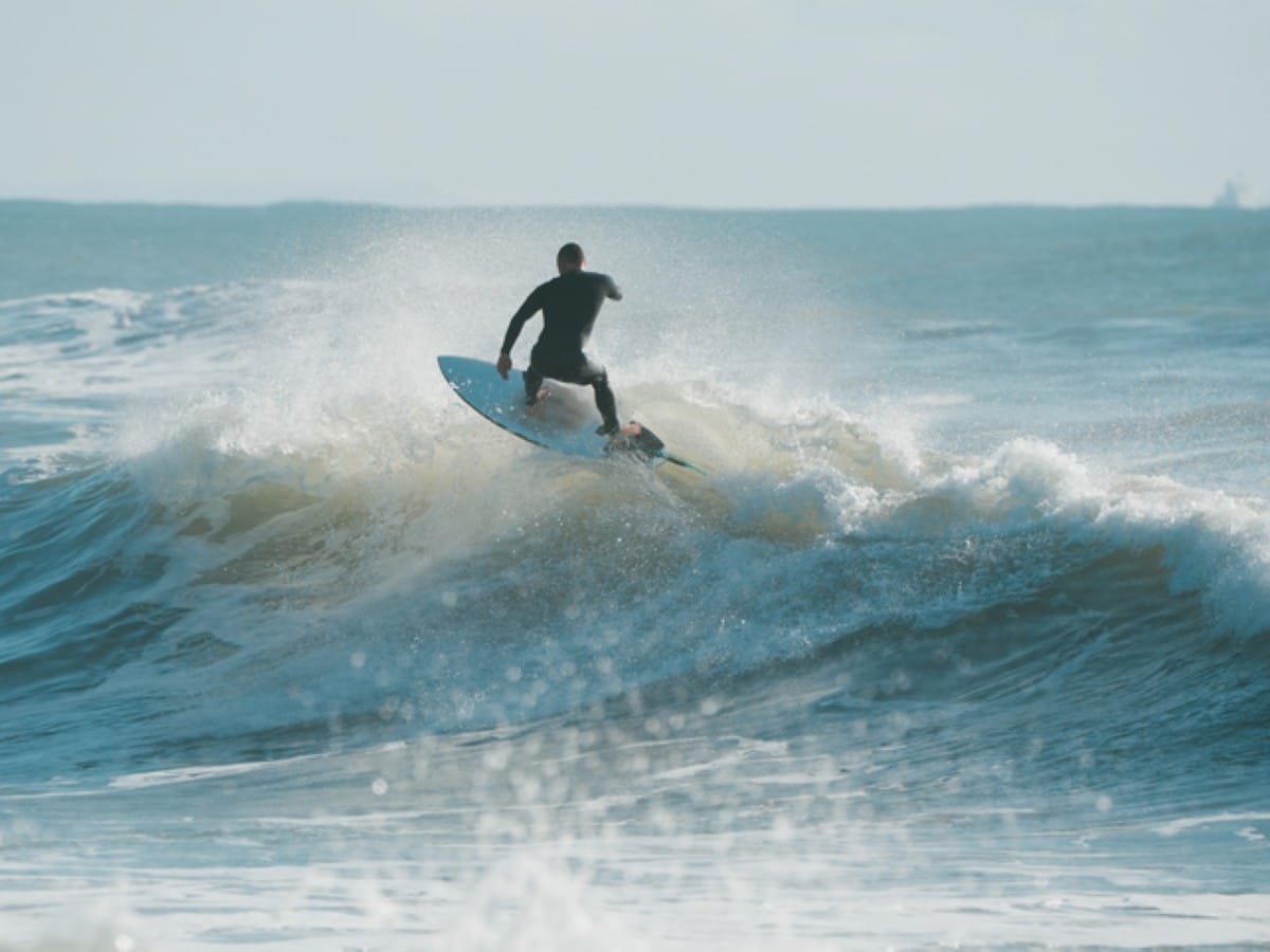 A shortboarder on Mount Maunganui's main beach