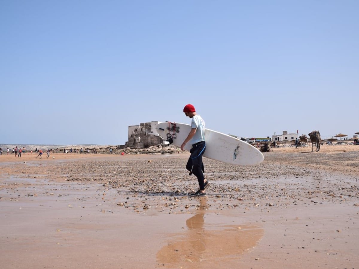 A surfer on the beach in Morocco