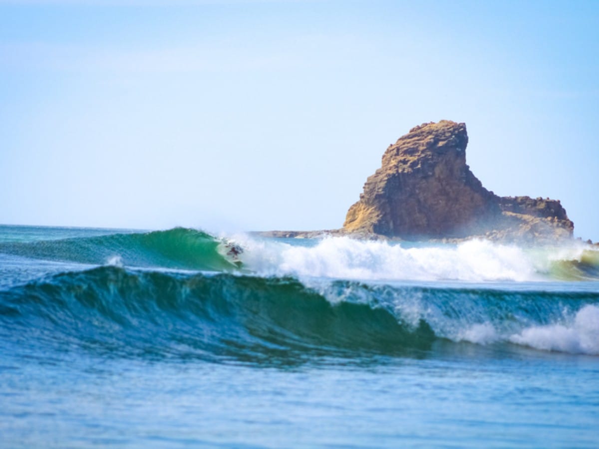 A surfer gets barreled in Playa Maderas, Nicaragua