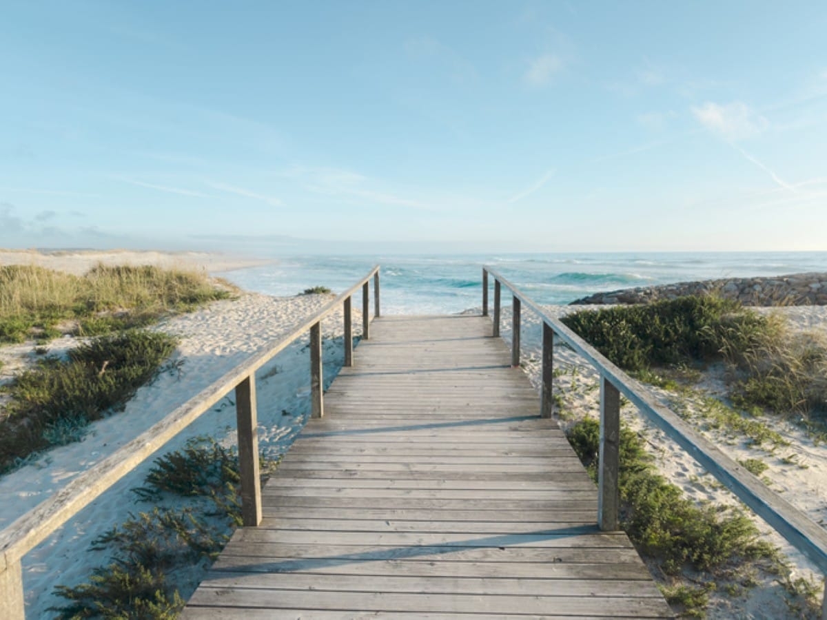 A boardwalk leads to the beach in Furadouro