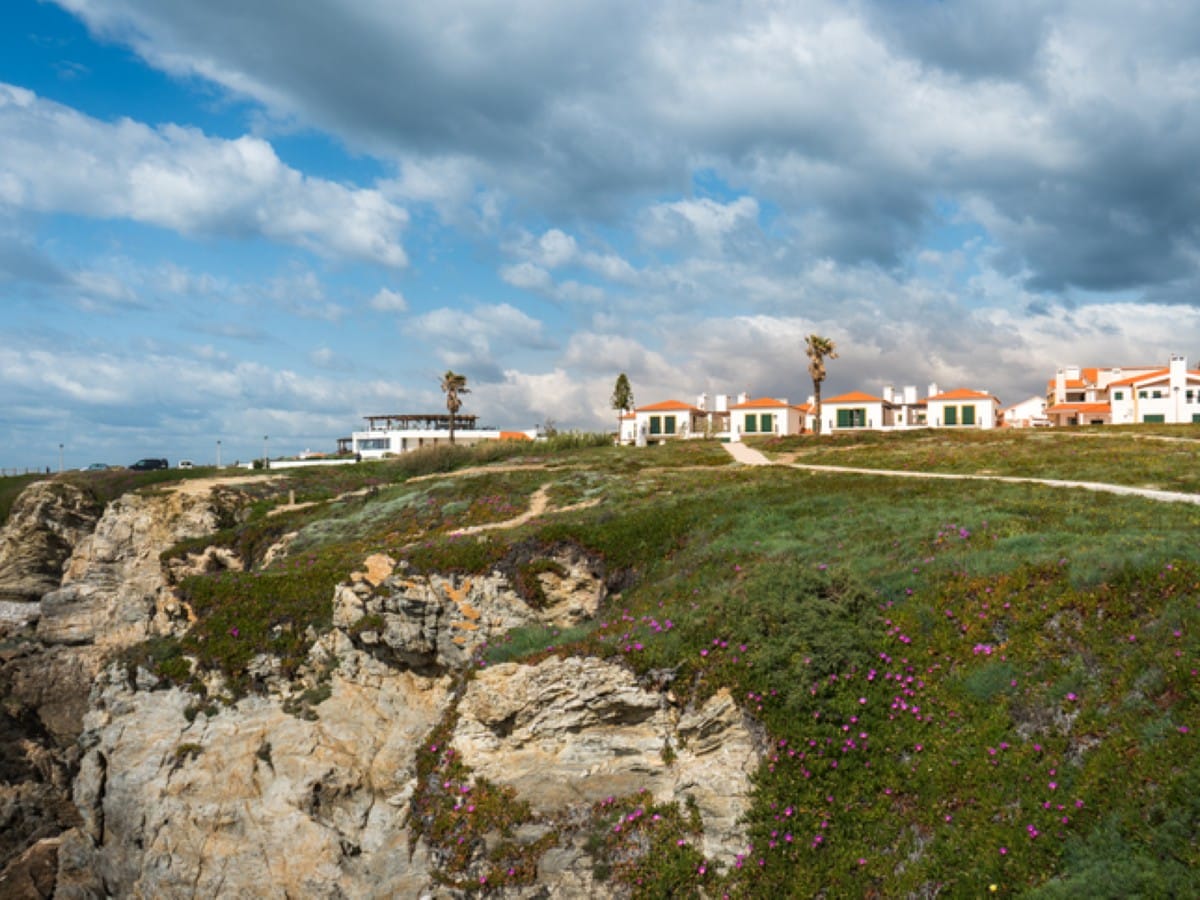 Houses top the cliffs in Porto Covo